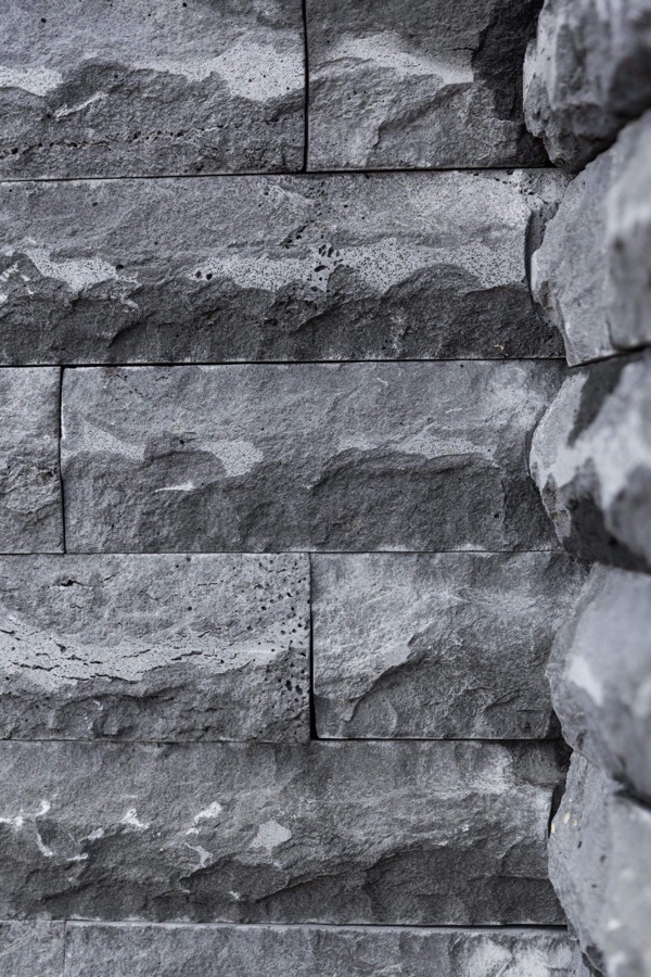 Rock-faced stone cladding wall, cut and laid by Stone Living